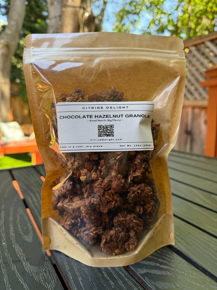 Chocolate Hazelnut Granola pouch from Citrine Delight – front of packaging on rustic background