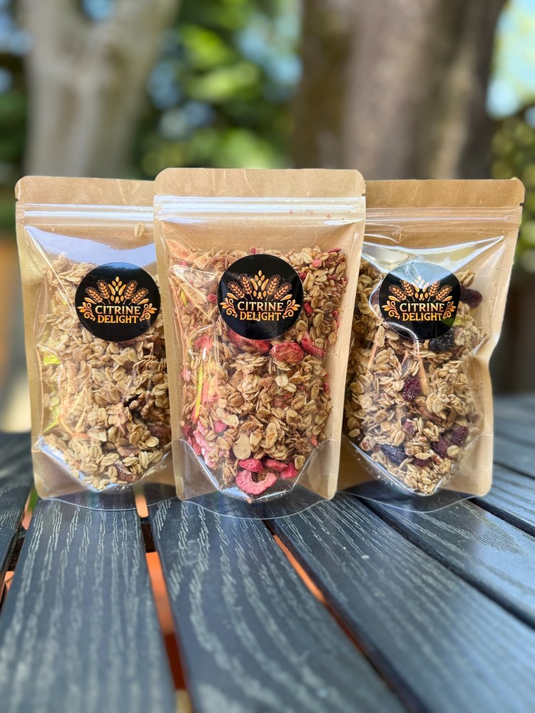 Three-flavor snack sample pack including Coconut, Strawberry Almond, and Pecan Berry, displayed in eco-friendly packaging