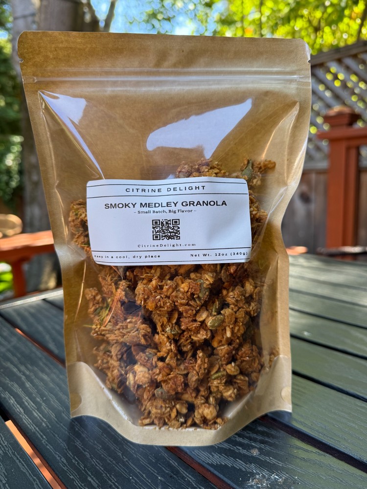 Smoky Medley Granola pouch from Citrine Delight – front of packaging on rustic background